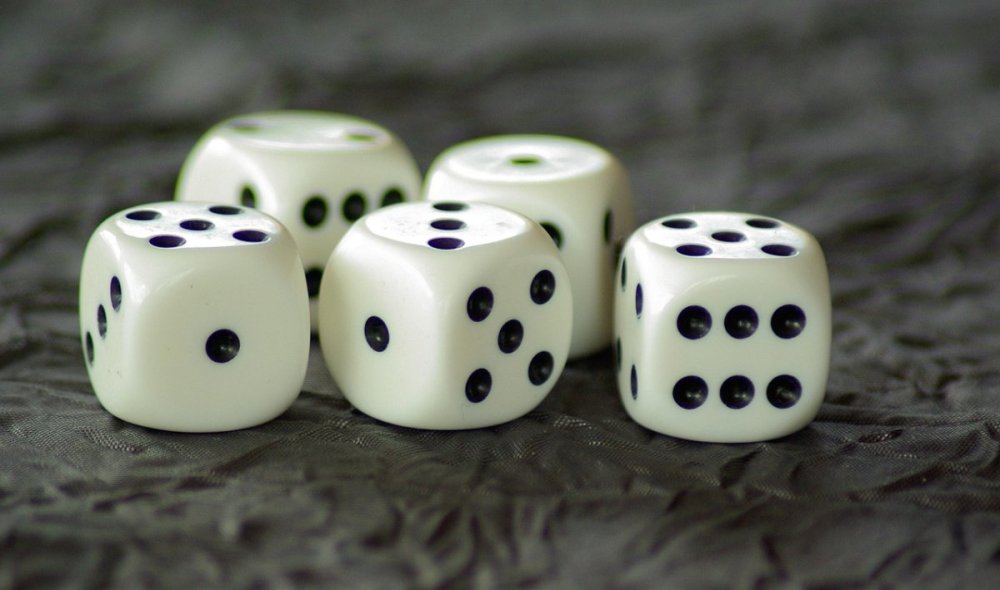 Dice showing numbers to symbolise chances at approval