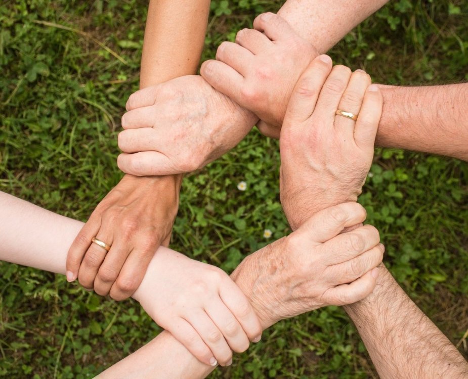 startup founders holding hands to show connection.